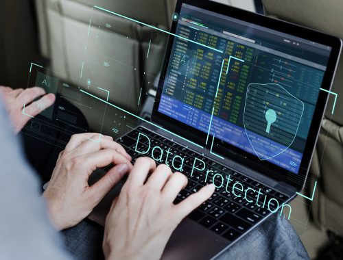 Businessman working on digital security in a car