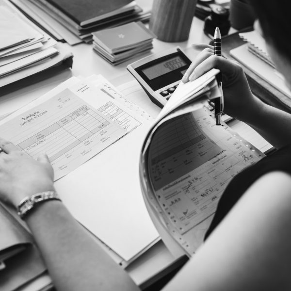Asian woman working through paperwork